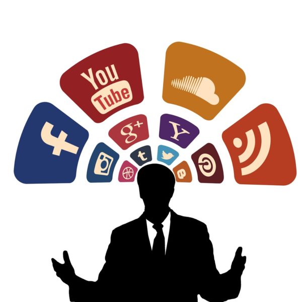 man in front of social media logos